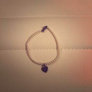 Tiffany’s tiny pearl heart bracelet
